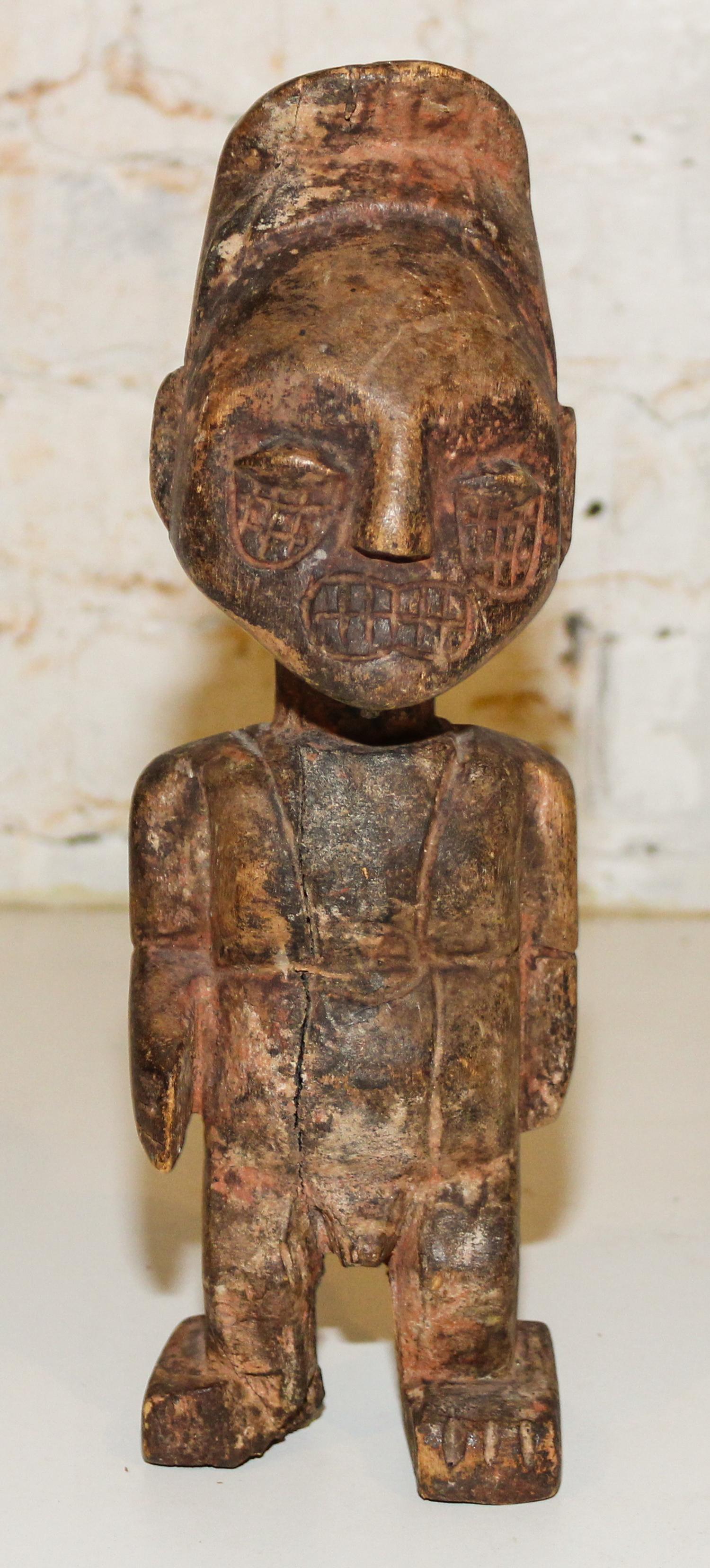 A Carved Wood Figure. Height 11 1/2 inches.