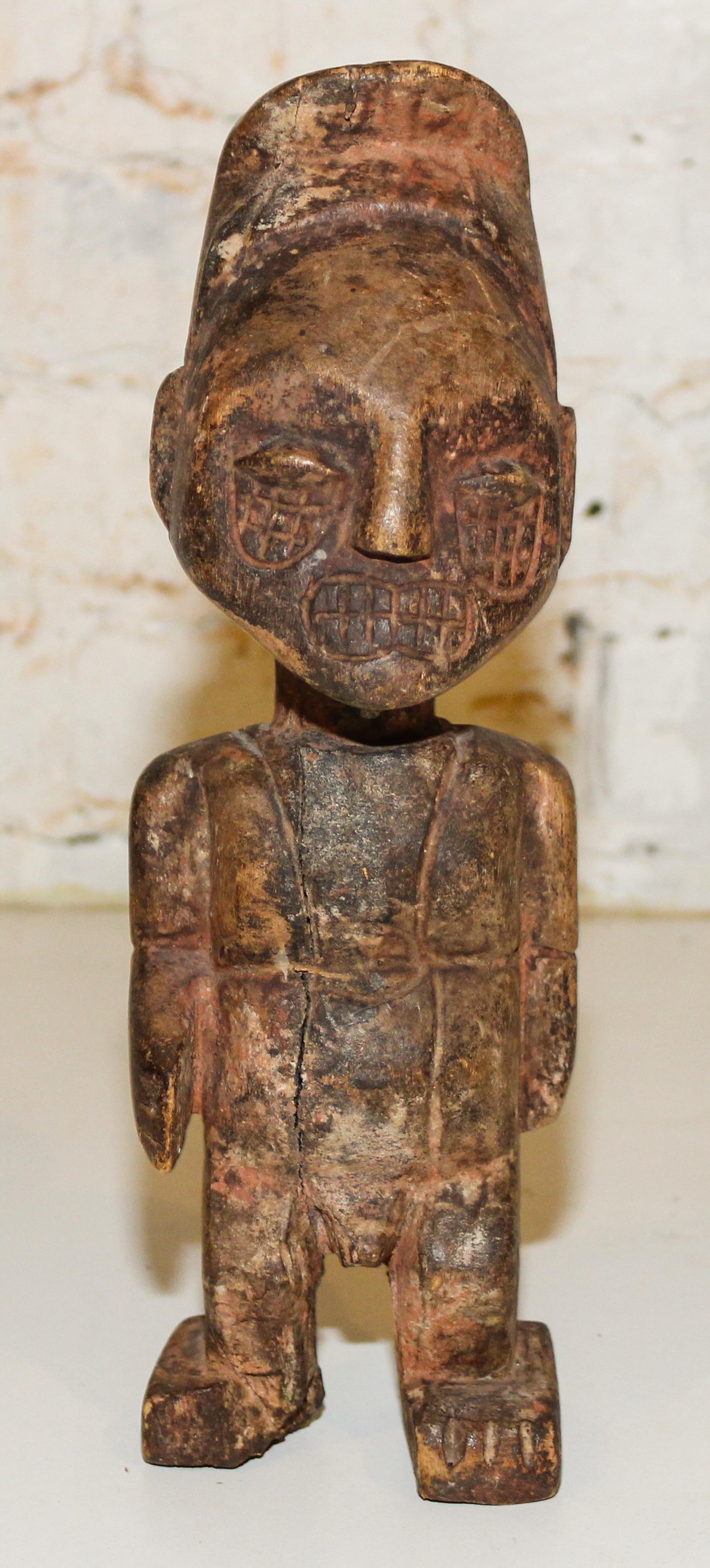 A Carved Wood Figure. Height 11 1/2 inches.