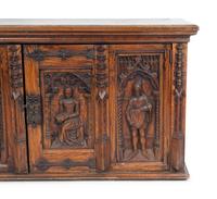 A Renaissance Revival Carved Oak Trunk with Iron Mounts — 19TH/20TH CENTURY
