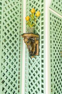 A Pair of Painted and Parcel Gilt Earthenware Elephant-Form Wall Brackets