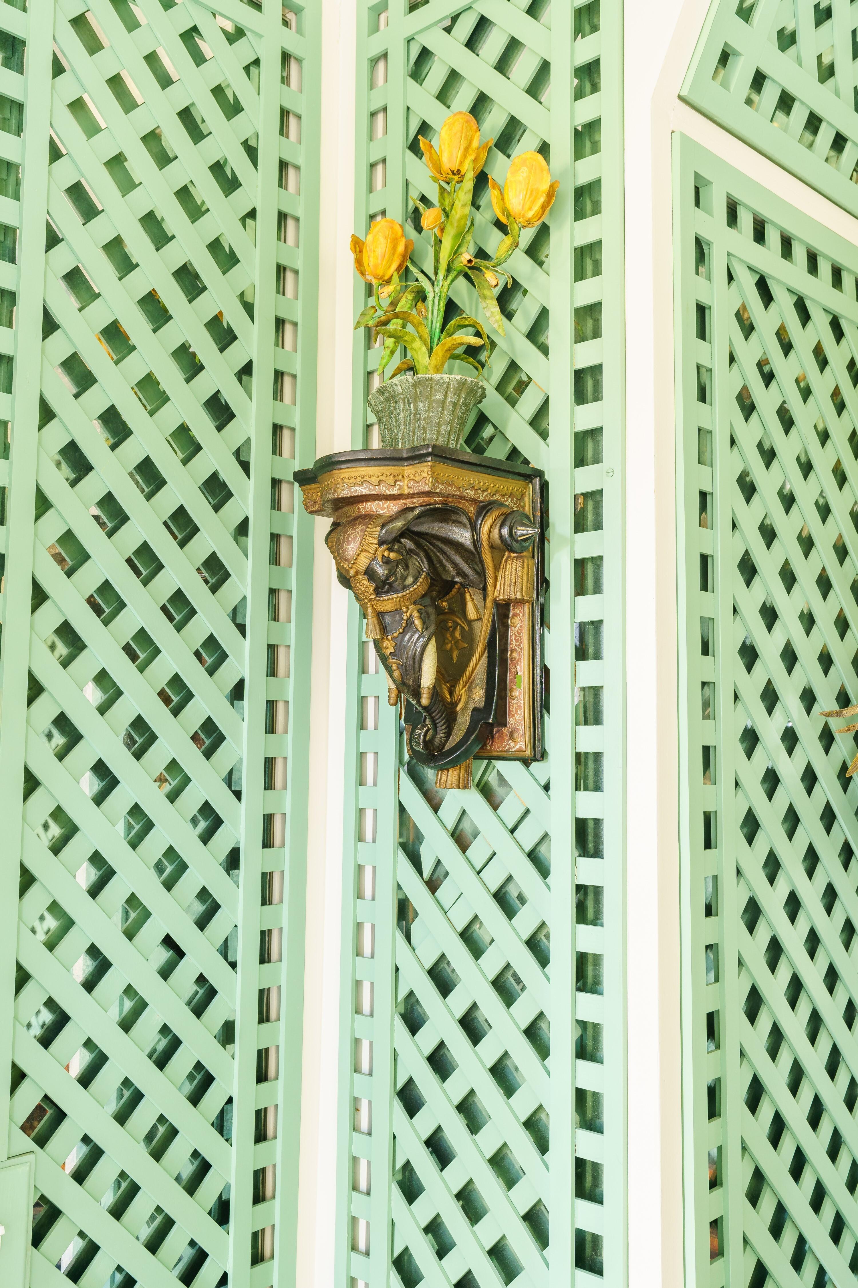 A Pair of Painted and Parcel Gilt Earthenware Elephant-Form Wall Brackets