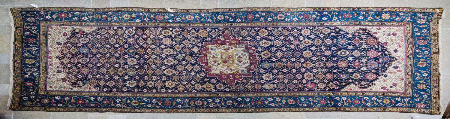 A Tabriz Wool Runner 15 feet 9 inches x 6 feet 11 inches.