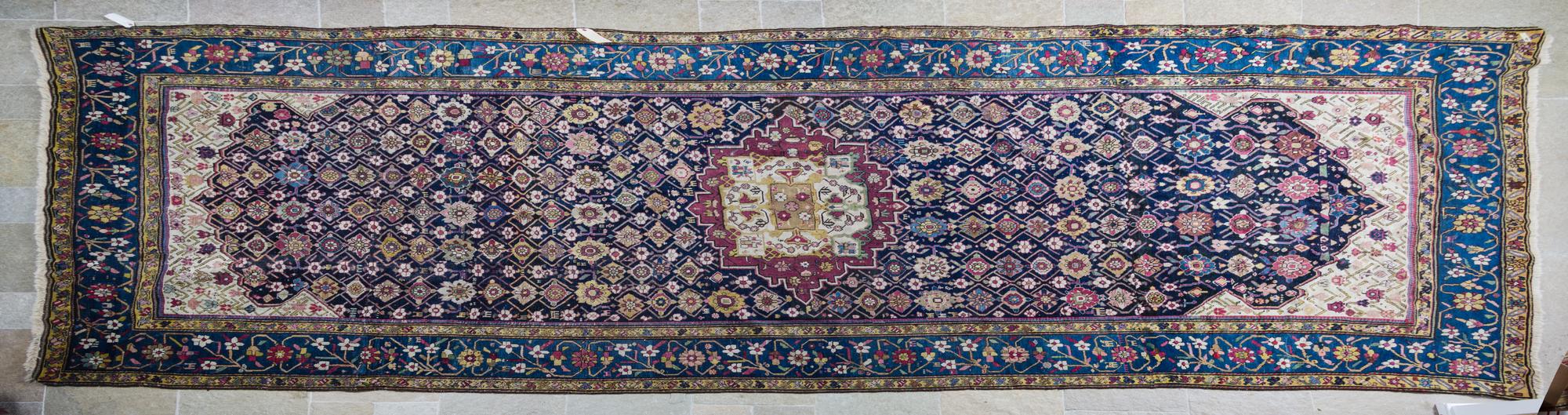 A Tabriz Wool Runner 15 feet 9 inches x 6 feet 11 inches.
