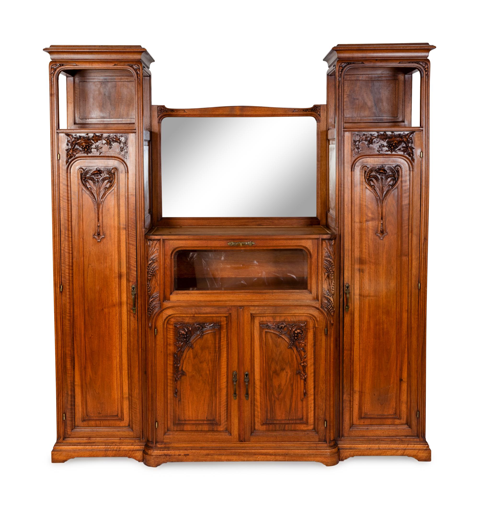 An Art Nouveau Carved Walnut Cabinet — FRENCH, EARLY 20TH CENTURY