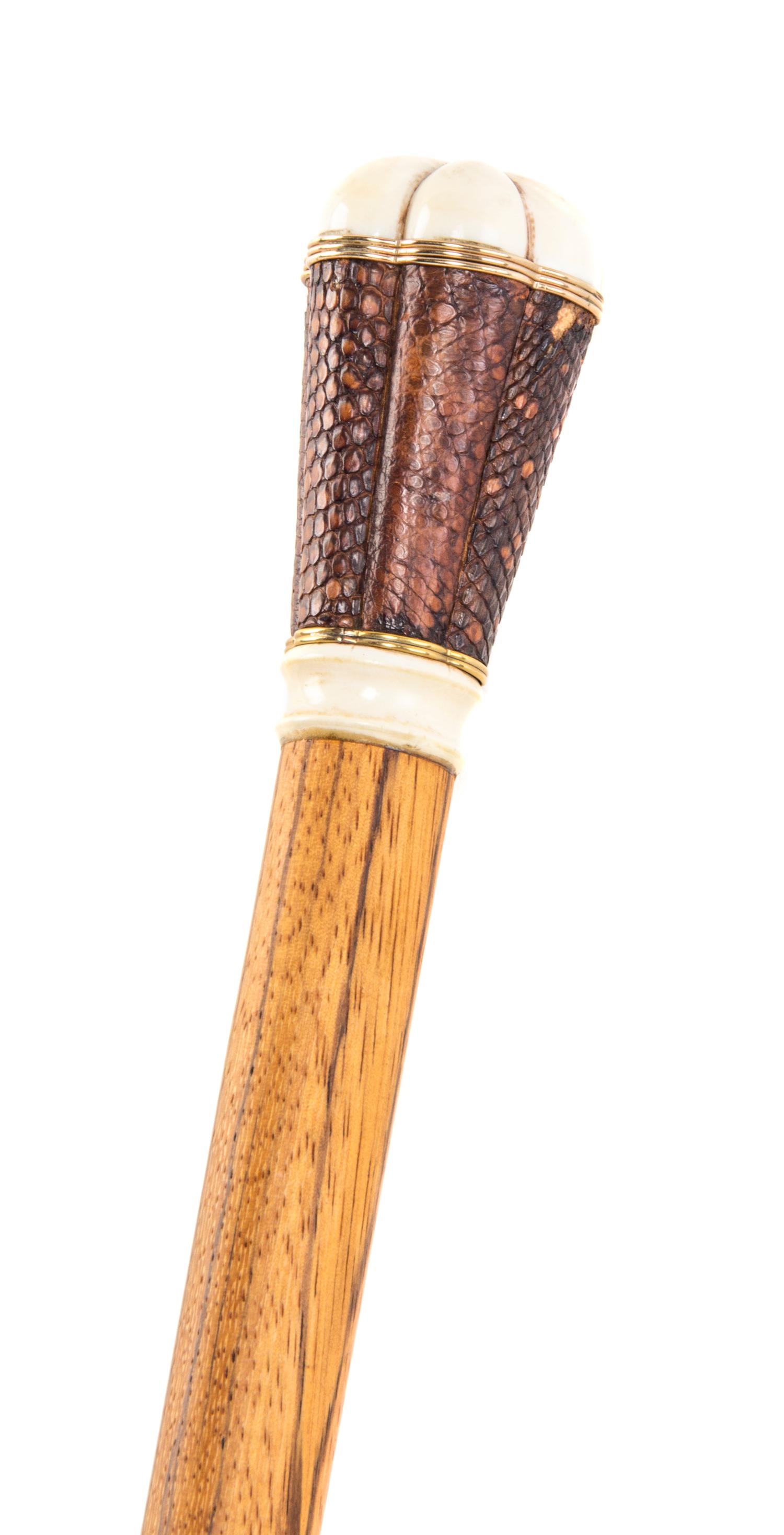 An American Ivory Handled Walking Stick, Length of handle 2 3/4 x length overall 34 7/8 inches.