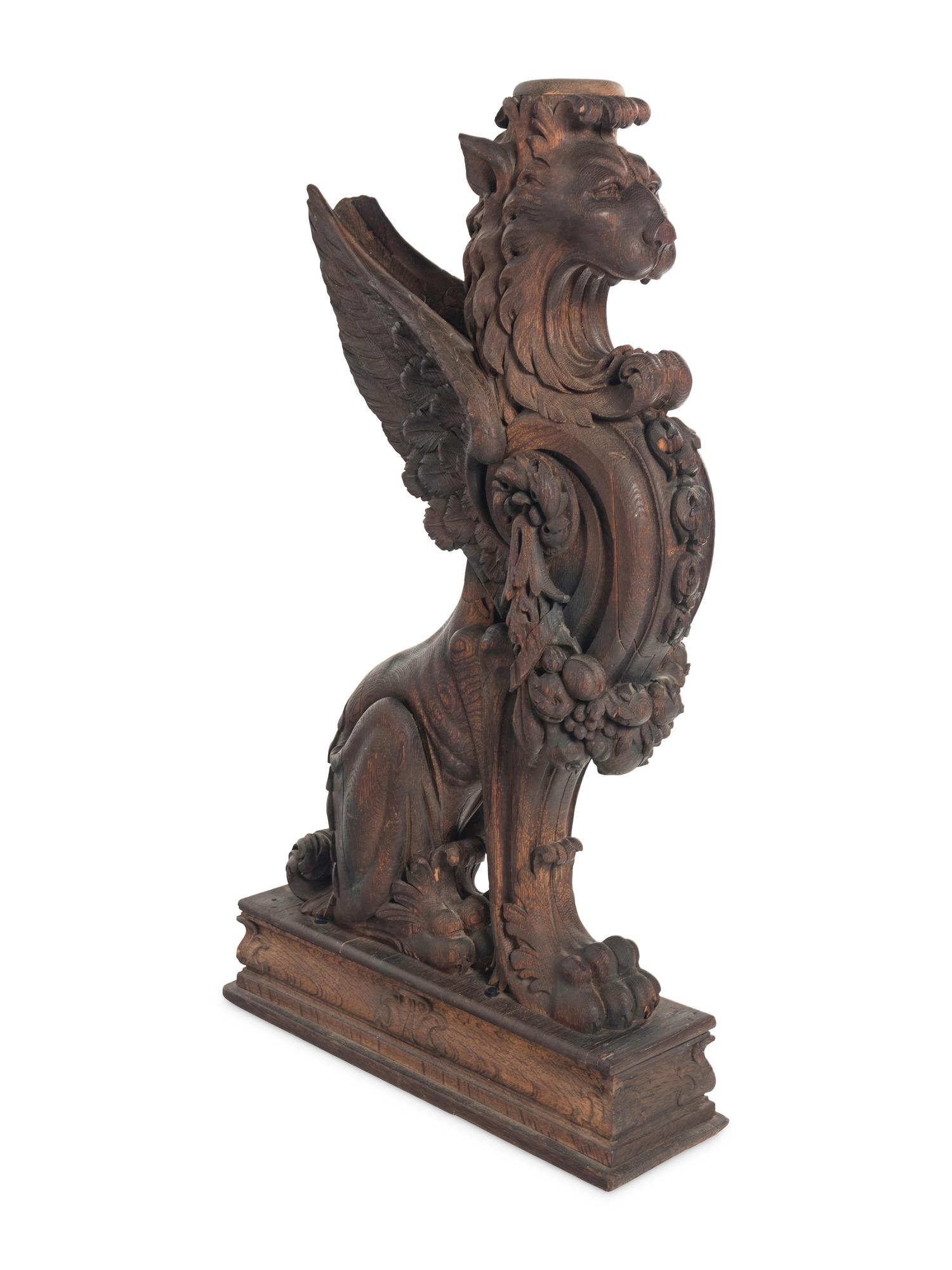 A Massive Carved Oak Griffin Newel Post