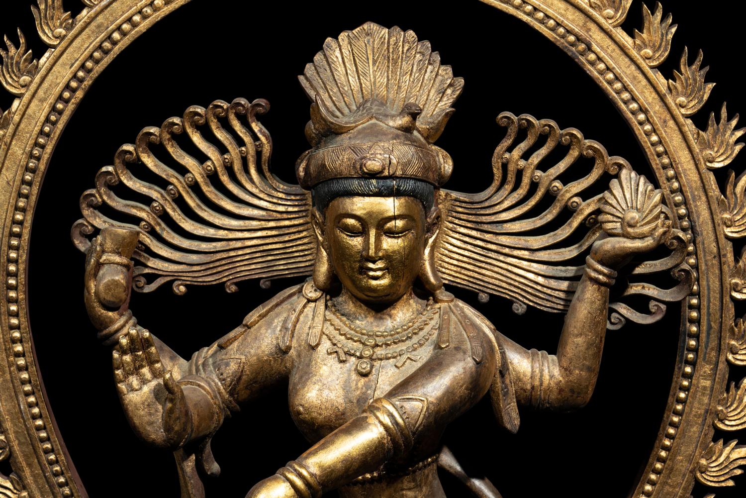 A Large Gilt and Red Lacquered Wood Figure of a Dancing Deity