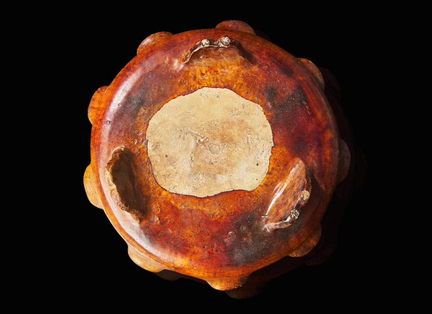 A Chinese sancai-glazed tripod dish with wood stand, possibly Ming dynasty 三彩三足盤帶底座 可能為明