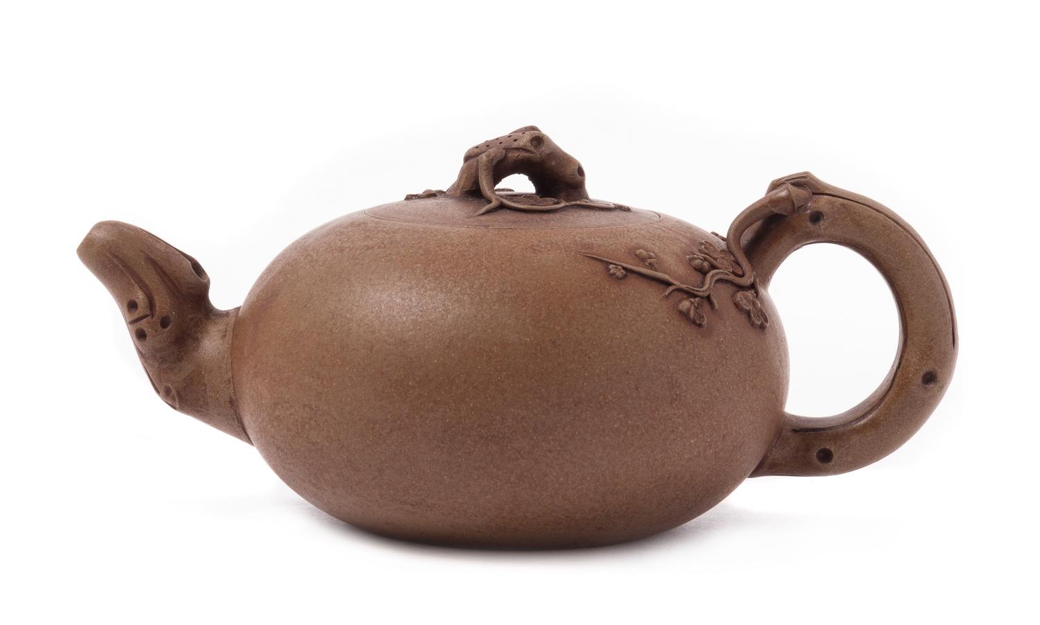 A Yixing Pottery Teapot Width over handles 7 3/4 inches.