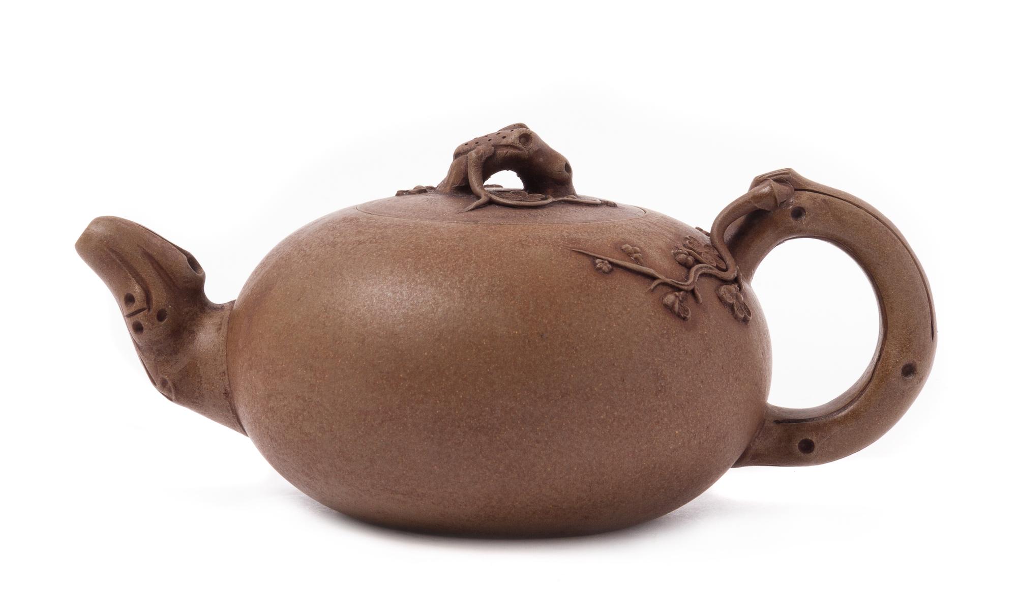A Yixing Pottery Teapot Width over handles 7 3/4 inches.