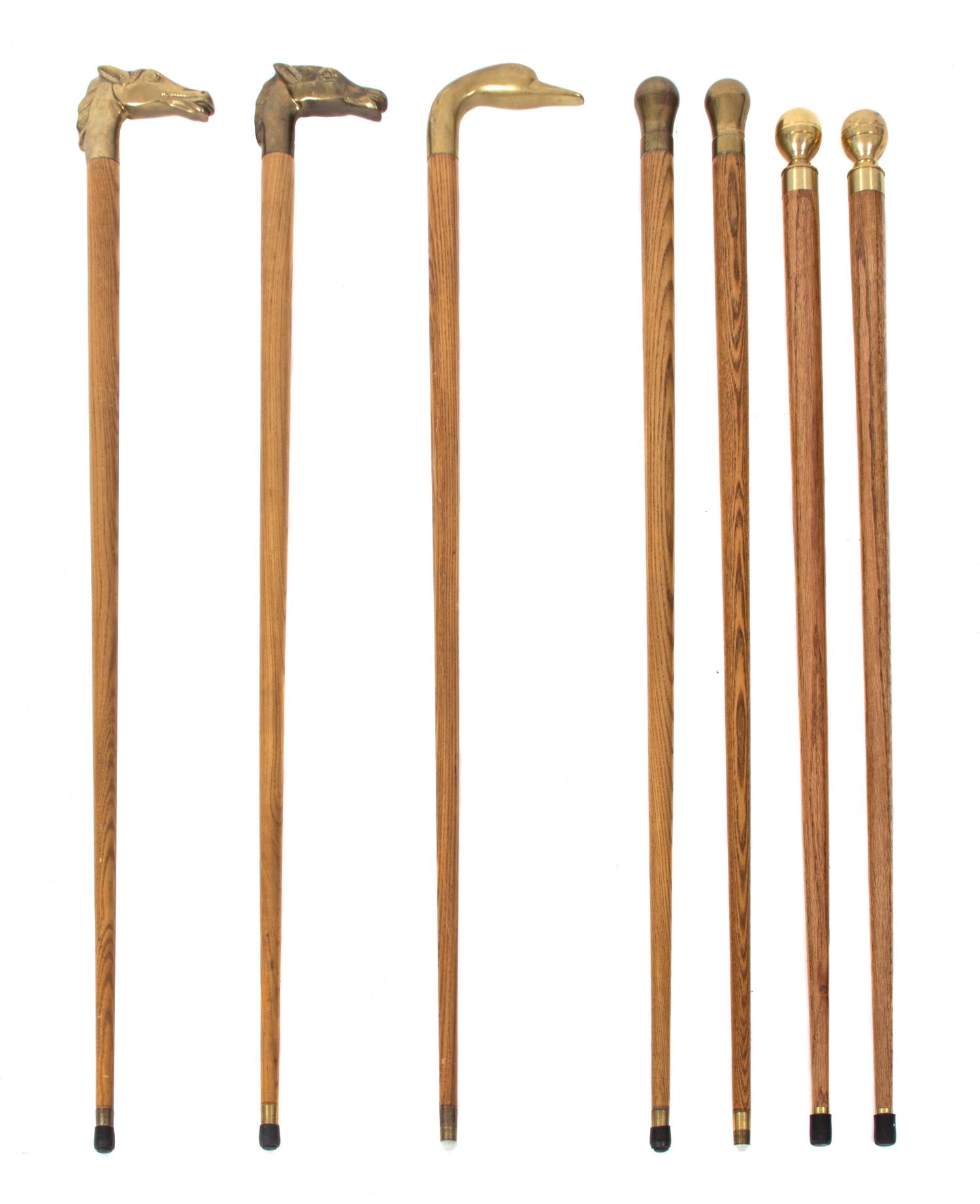 A Collection of Seven Brass Handled Ash Canes Length of tallest 35 1/2 inches. — 20TH CENTURY