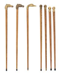 A Collection of Seven Brass Handled Ash Canes Length of tallest 35 1/2 inches. — 20TH CENTURY