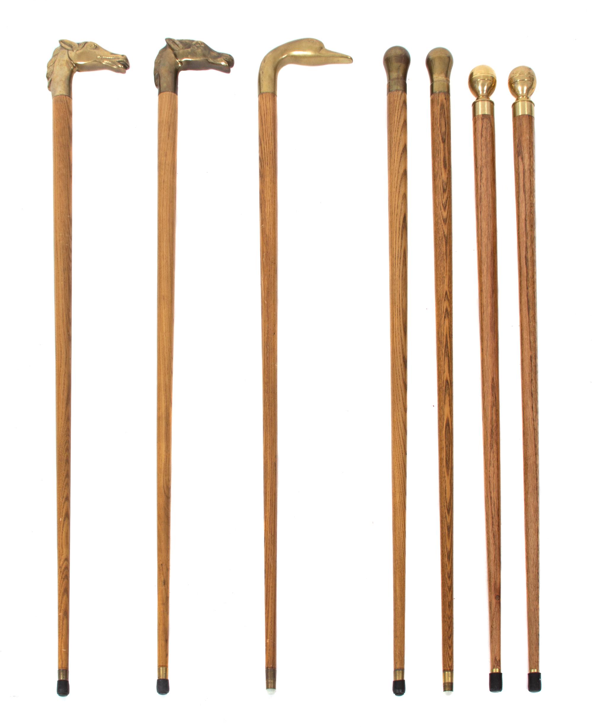 A Collection of Seven Brass Handled Ash Canes Length of tallest 35 1/2 inches. — 20TH CENTURY