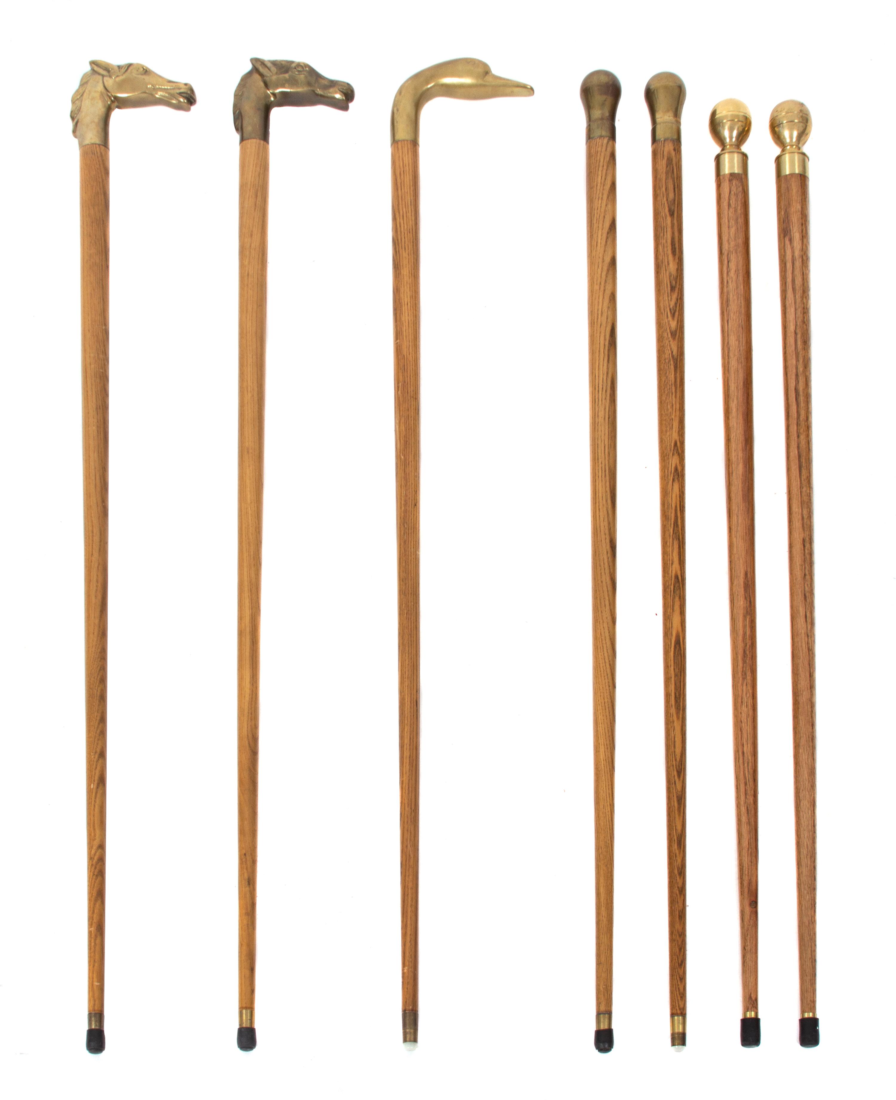 A Collection of Seven Brass Handled Ash Canes Length of tallest 35 1/2 inches. — 20TH CENTURY