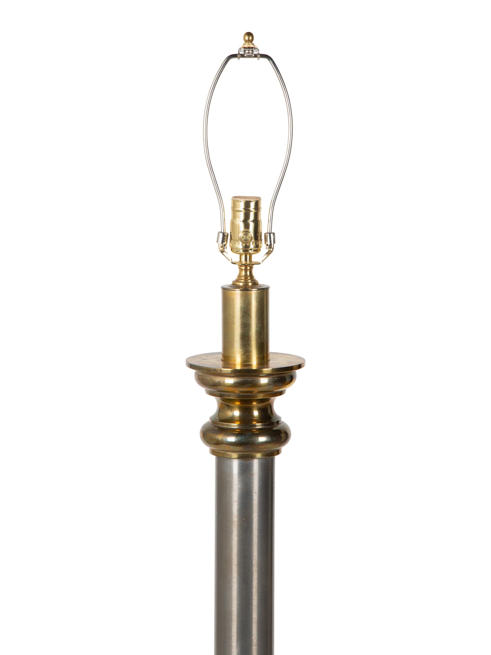 A Steel and Brass Floor Lamp — 20TH CENTURY