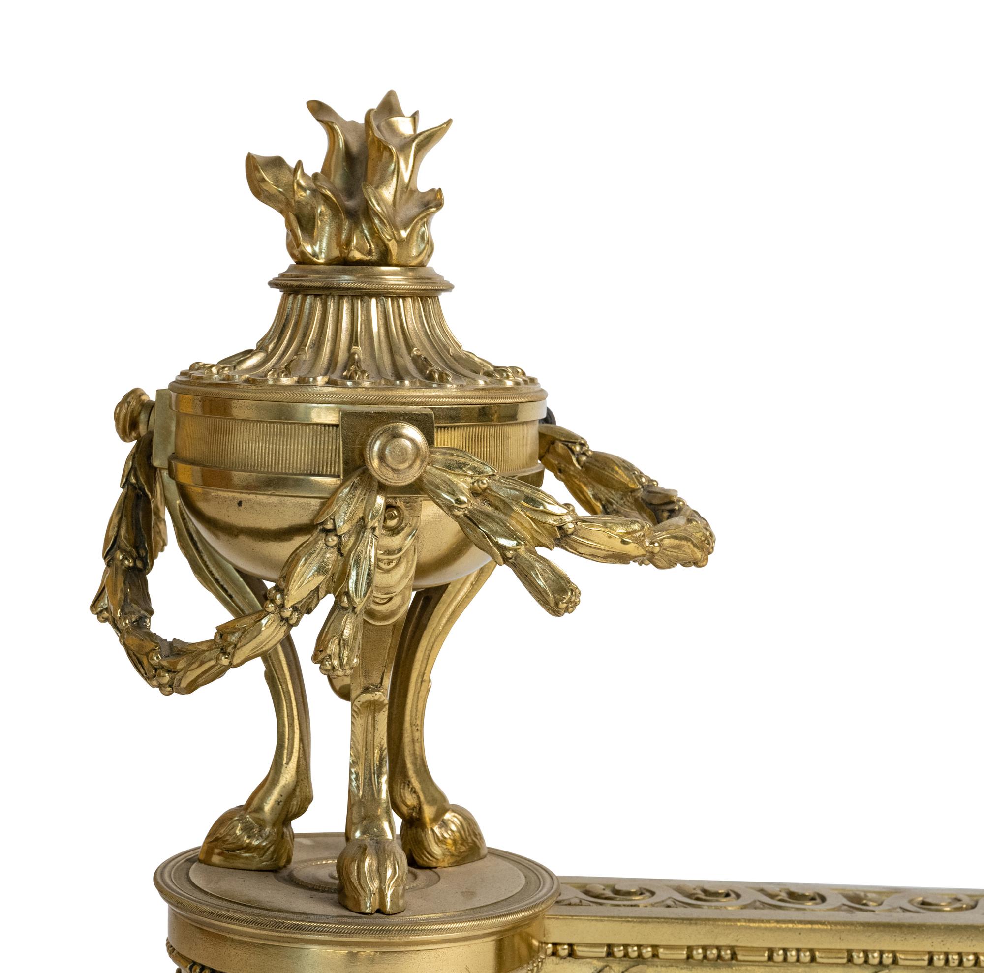 A Pair of Louis XVI Style Gilt Bronze Chenets with Flaming Urn Finials — 20TH CENTURY
