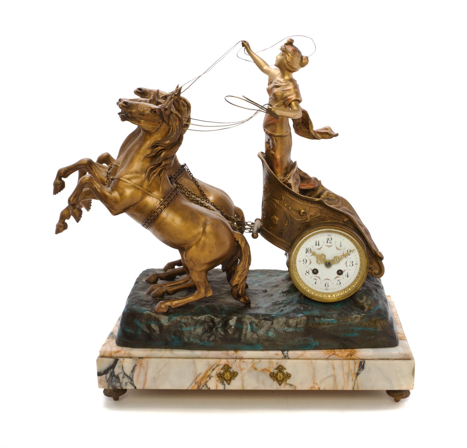 A French Gilt Metal and Marble Figural Clock, Height 20 3/4 inches.