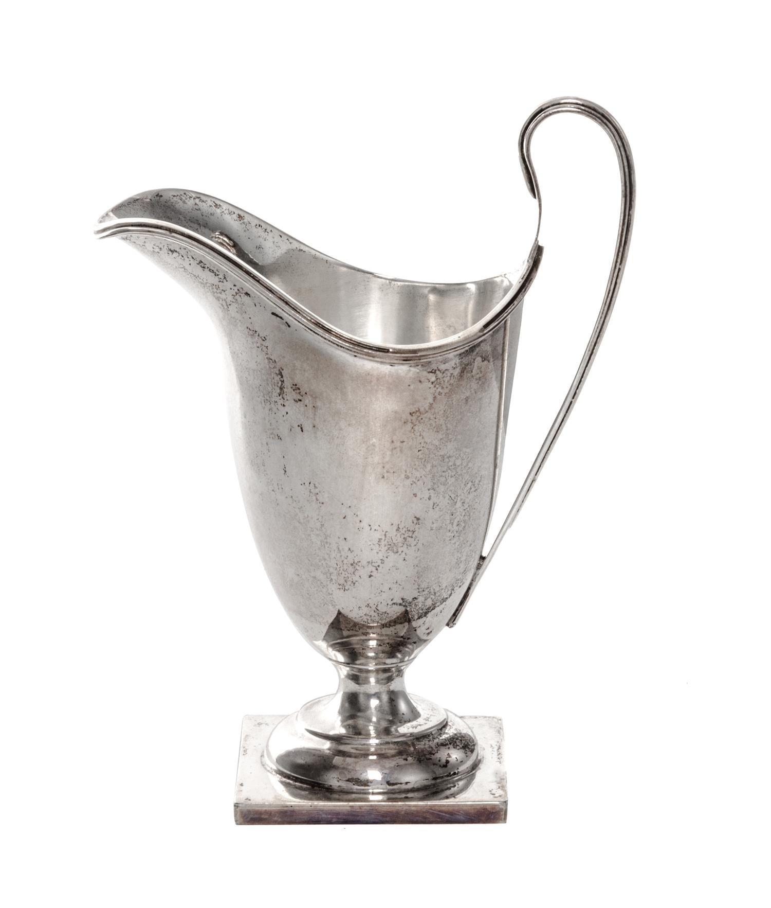 A George VI Silver Creamer, William Duncan Cooper, London, 1937, of enlogated helmet form on a square base.