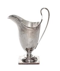 A George VI Silver Creamer, William Duncan Cooper, London, 1937, of enlogated helmet form on a square base.