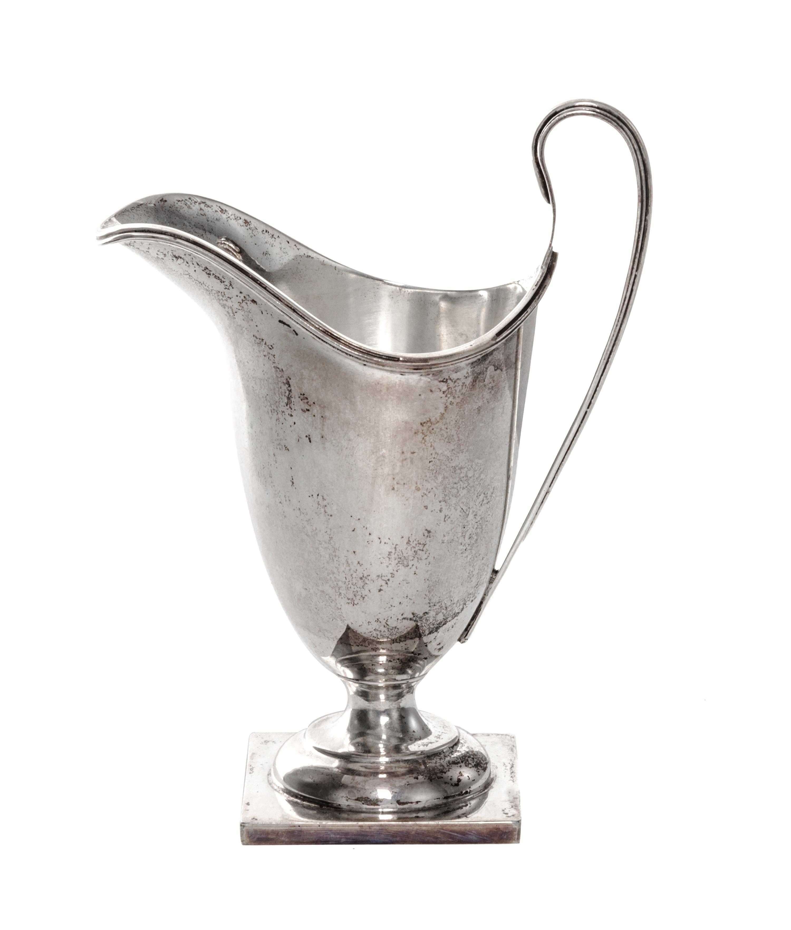 A George VI Silver Creamer, William Duncan Cooper, London, 1937, of enlogated helmet form on a square base.