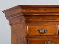 A Queen Anne Shell-Carved and Figured Maple Flat-Top High Chest of Drawers