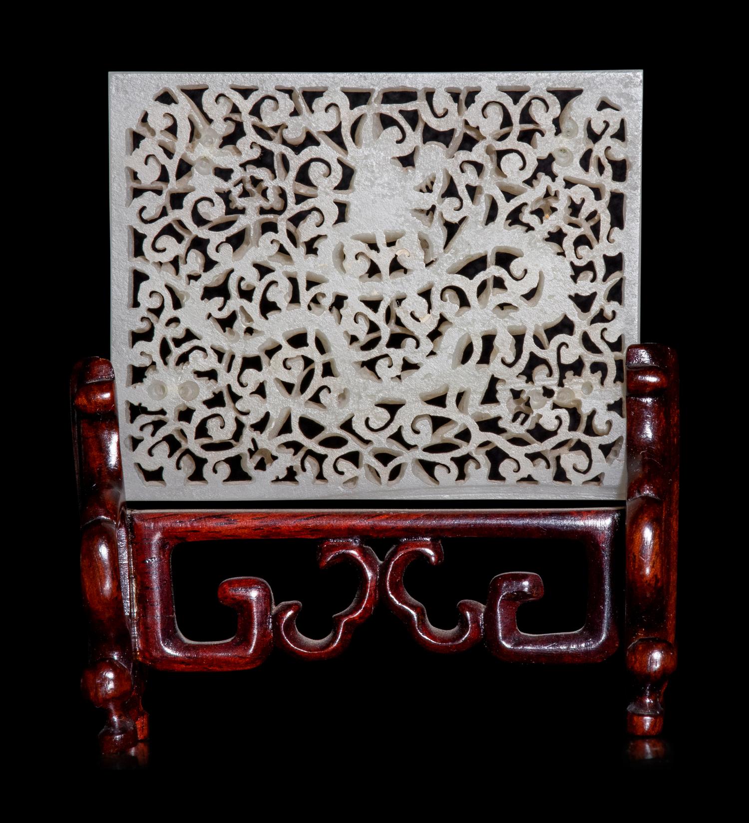 A Reticulated White Jade 'Dragon' Plaque