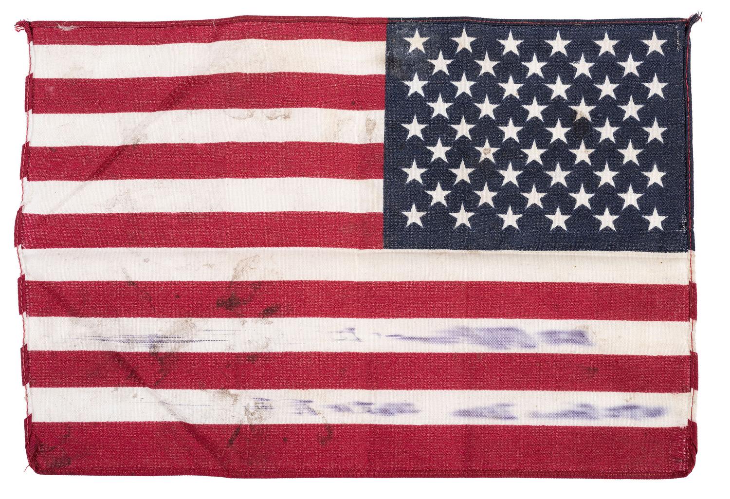 [FLAGS]. A group of items related to the recovery efforts at Ground Zero after September 11, 2011, incl. a helmet worn at the site by retired NYC Detective Arthur Giammarino as he assisted in the recovery efforts.