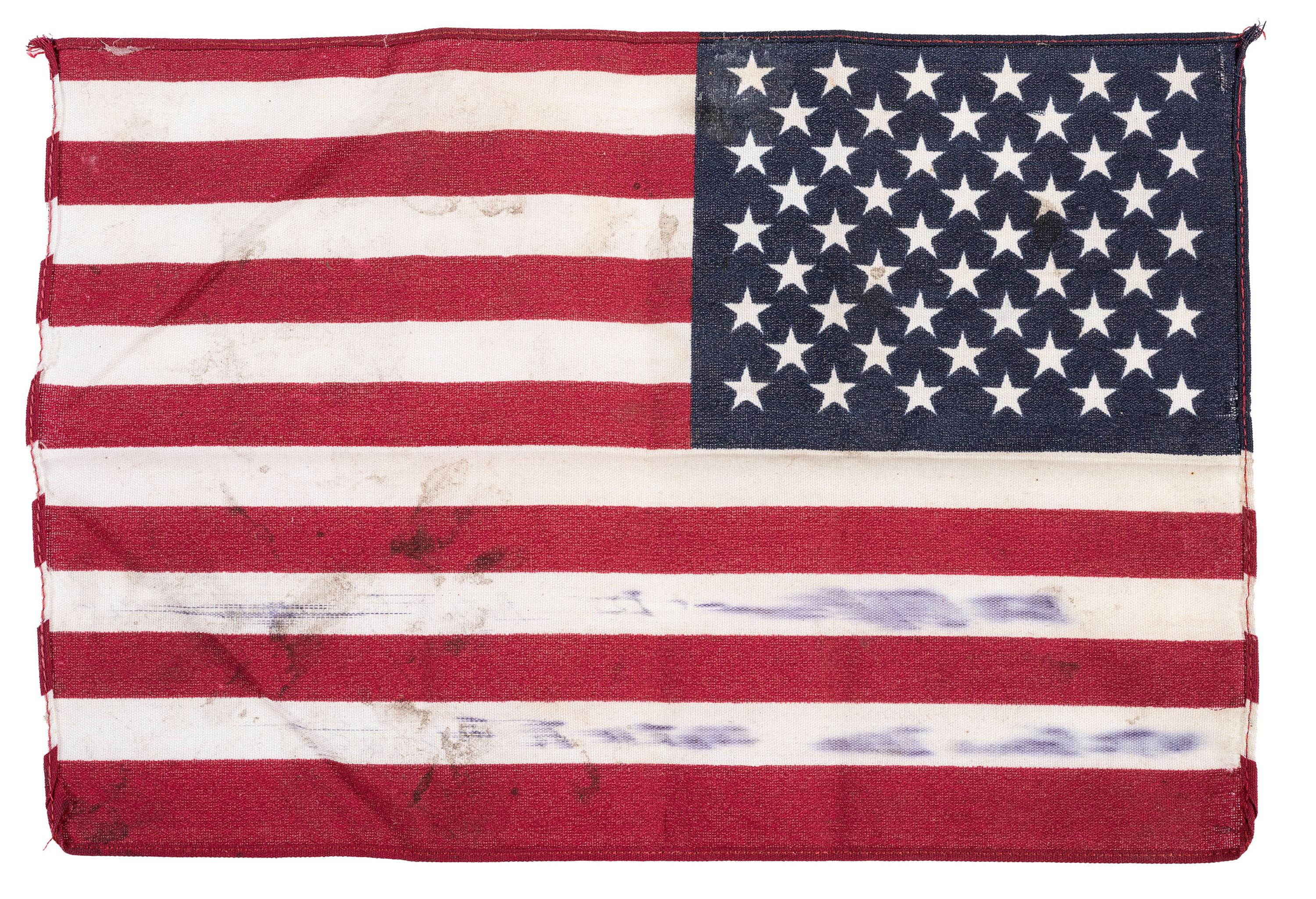 [FLAGS]. A group of items related to the recovery efforts at Ground Zero after September 11, 2011, incl. a helmet worn at the site by retired NYC Detective Arthur Giammarino as he assisted in the recovery efforts.