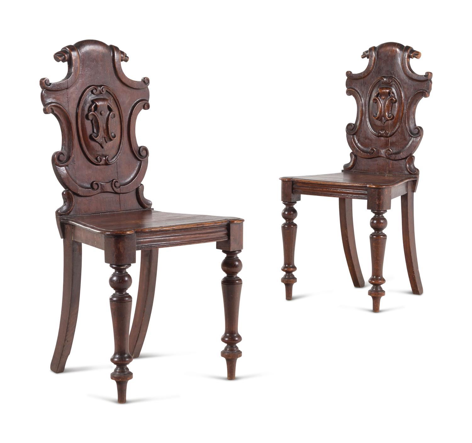 A Pair of Regency Style Oak Hall Chairs