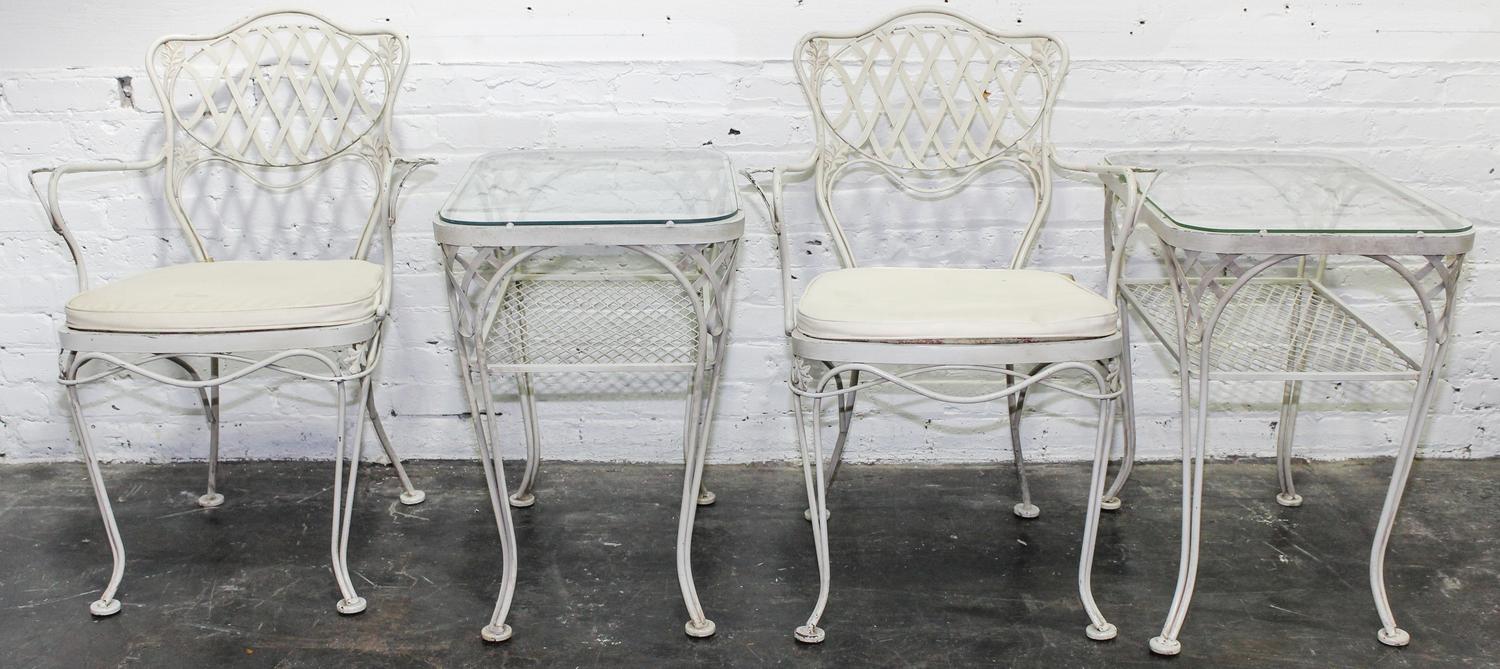 A Woodard Enameled Patio Set Height of circular table 18 x diameter 36 1/4 inches.