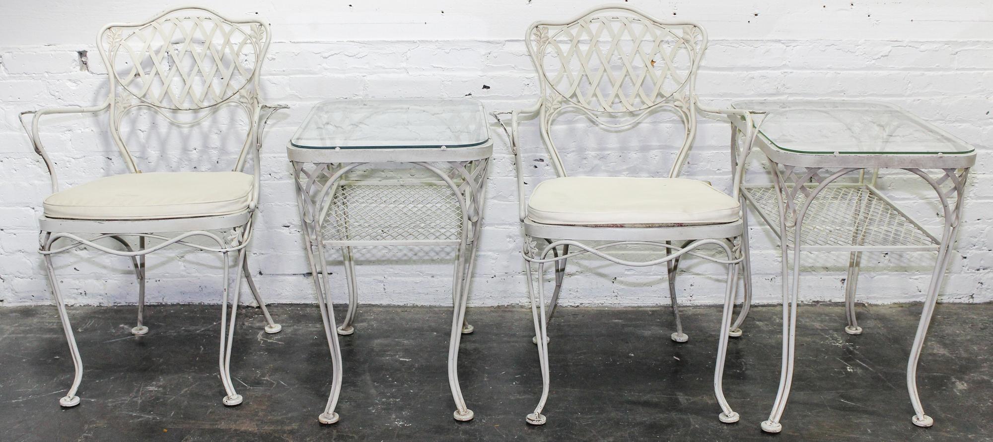 A Woodard Enameled Patio Set Height of circular table 18 x diameter 36 1/4 inches.