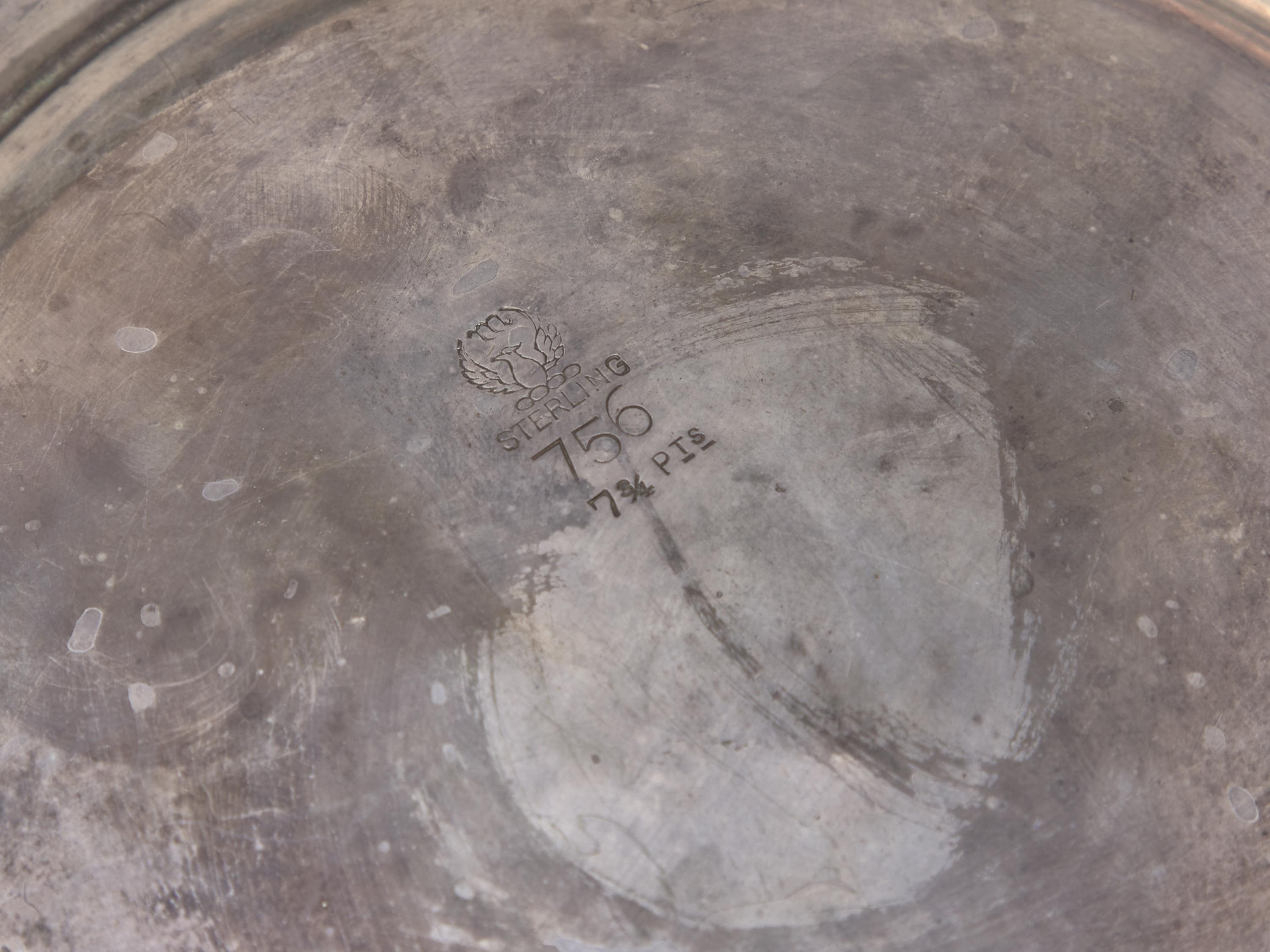 An American Sterling Silver Repousse Water Pitcher