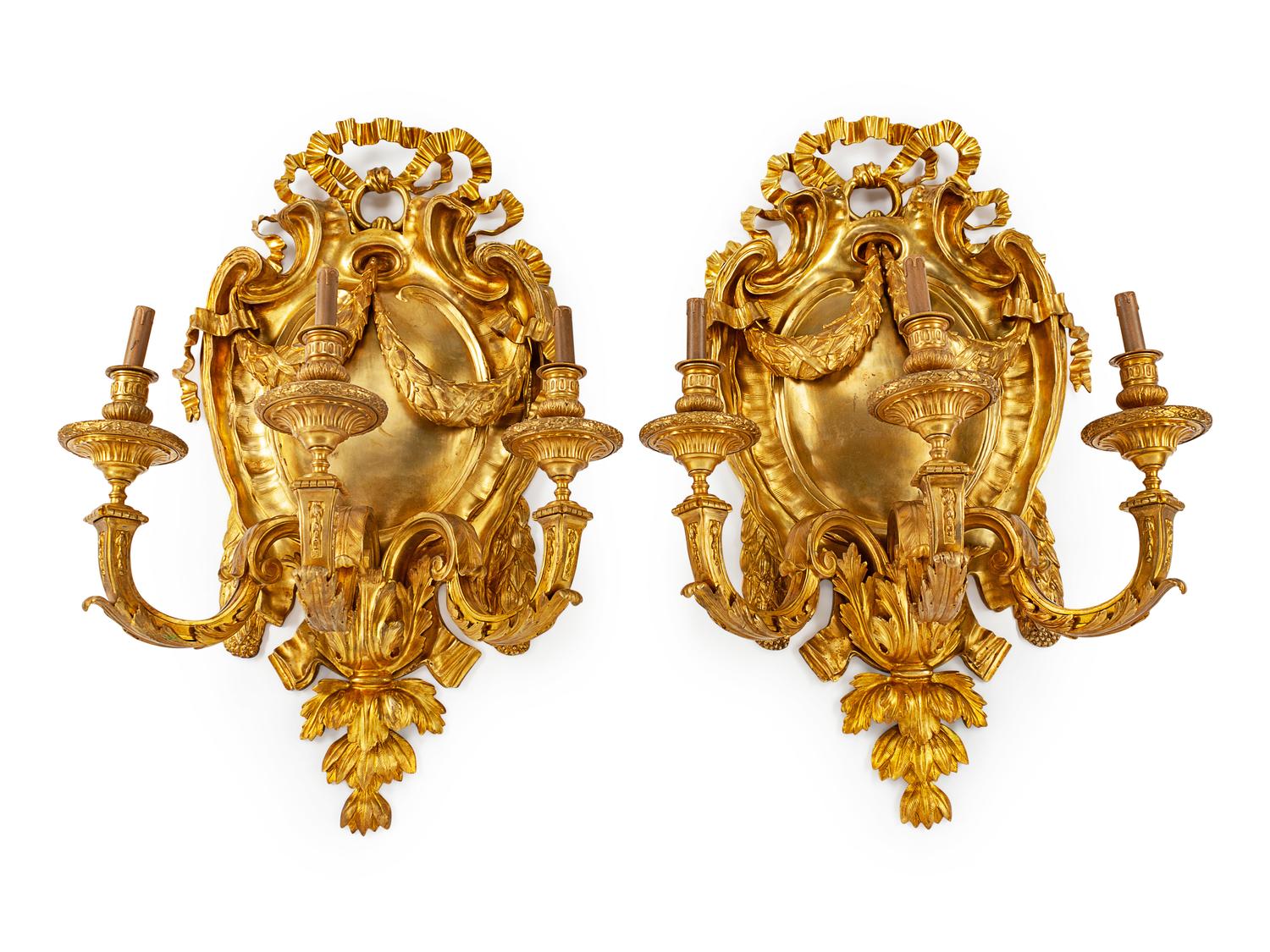 A Pair of Large Gilt Metal Shield-Form Three-Light Sconces