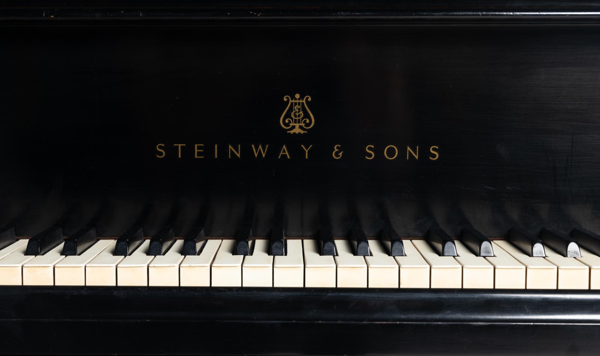 A Steinway and Sons Black Lacquer Baby Grand Piano