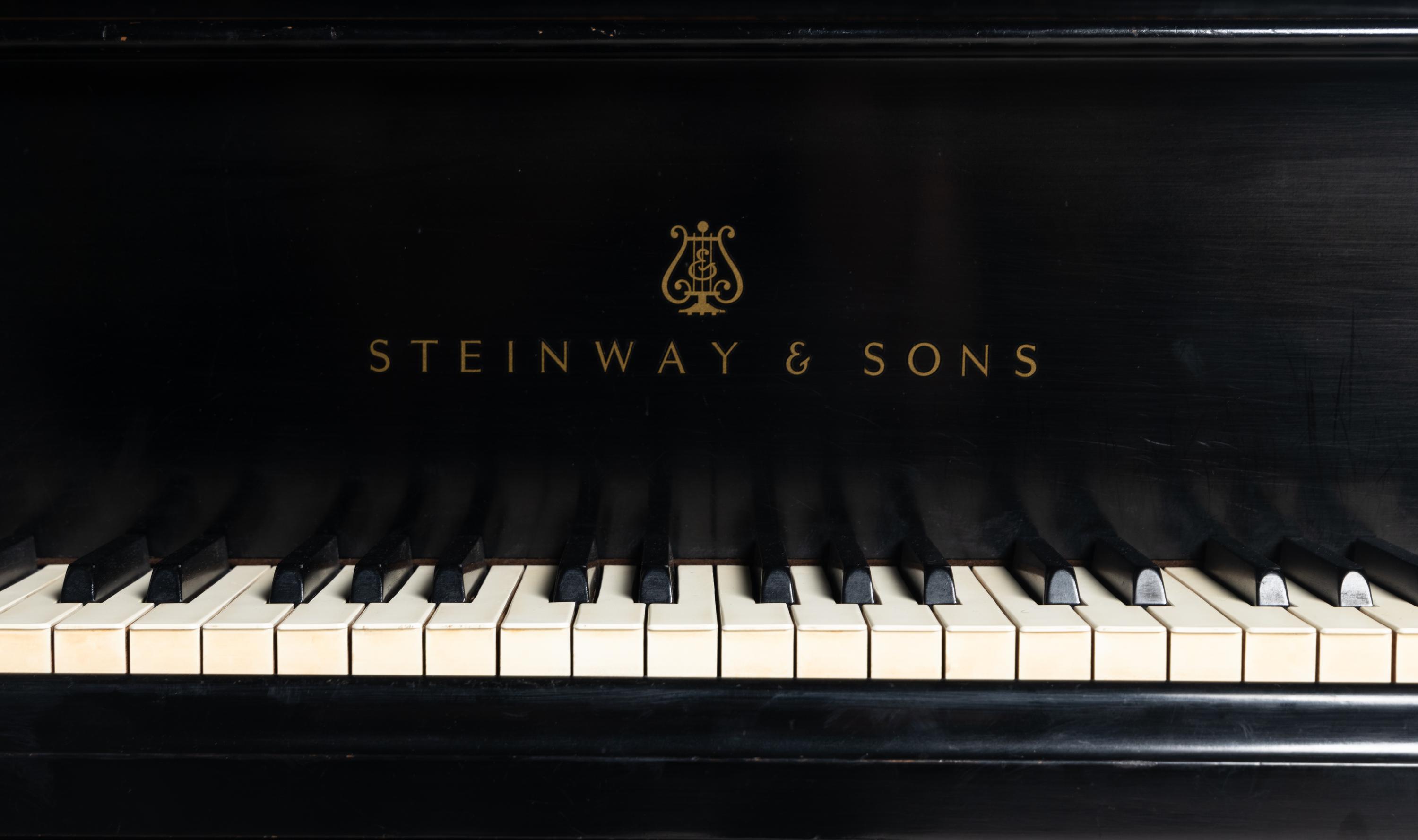 A Steinway and Sons Black Lacquer Baby Grand Piano