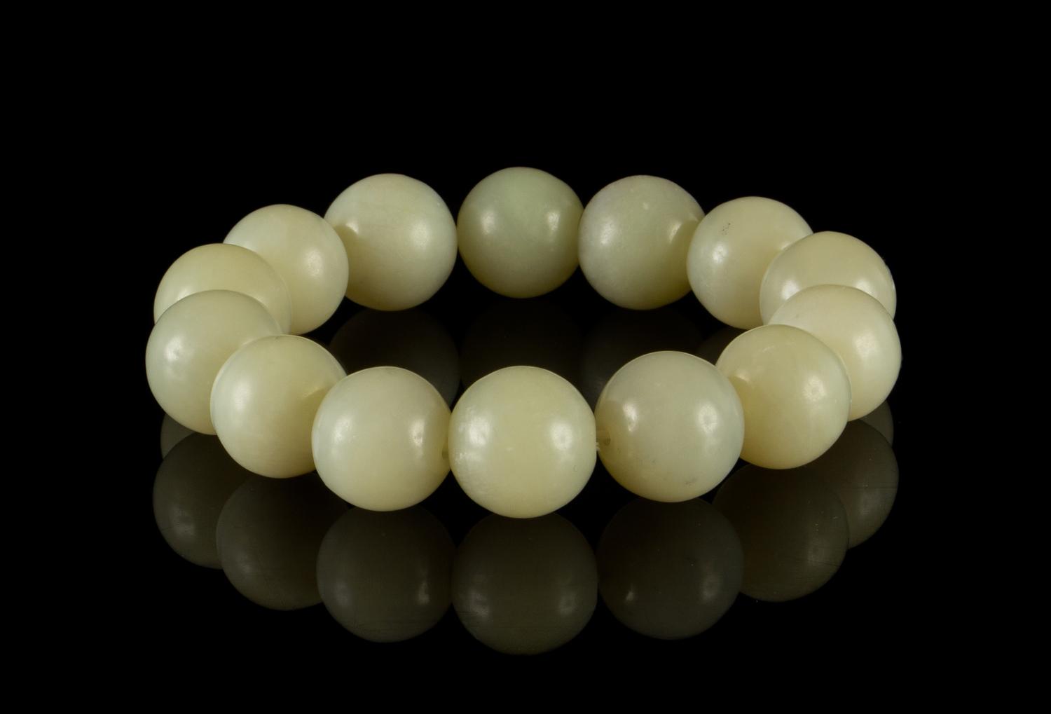 A Celadon Jade Bead Strand