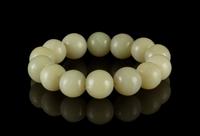 A Celadon Jade Bead Strand