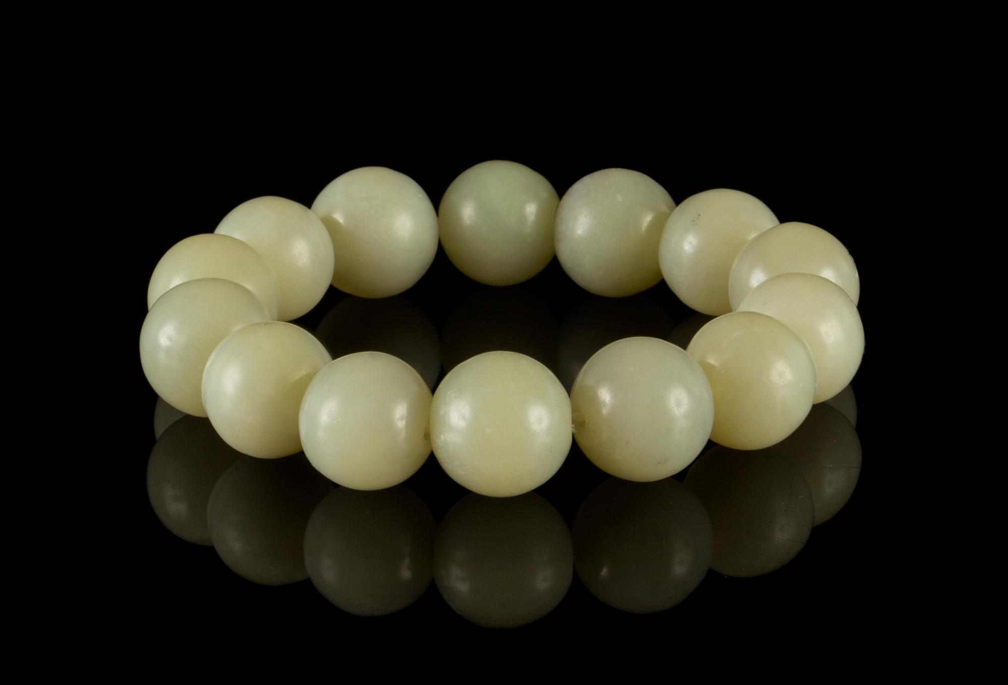A Celadon Jade Bead Strand