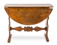 An Italian Walnut Drop-Leaf Table Height 32 x width 43 x depth 15 1/4 inches (closed). — 18TH CENTURY