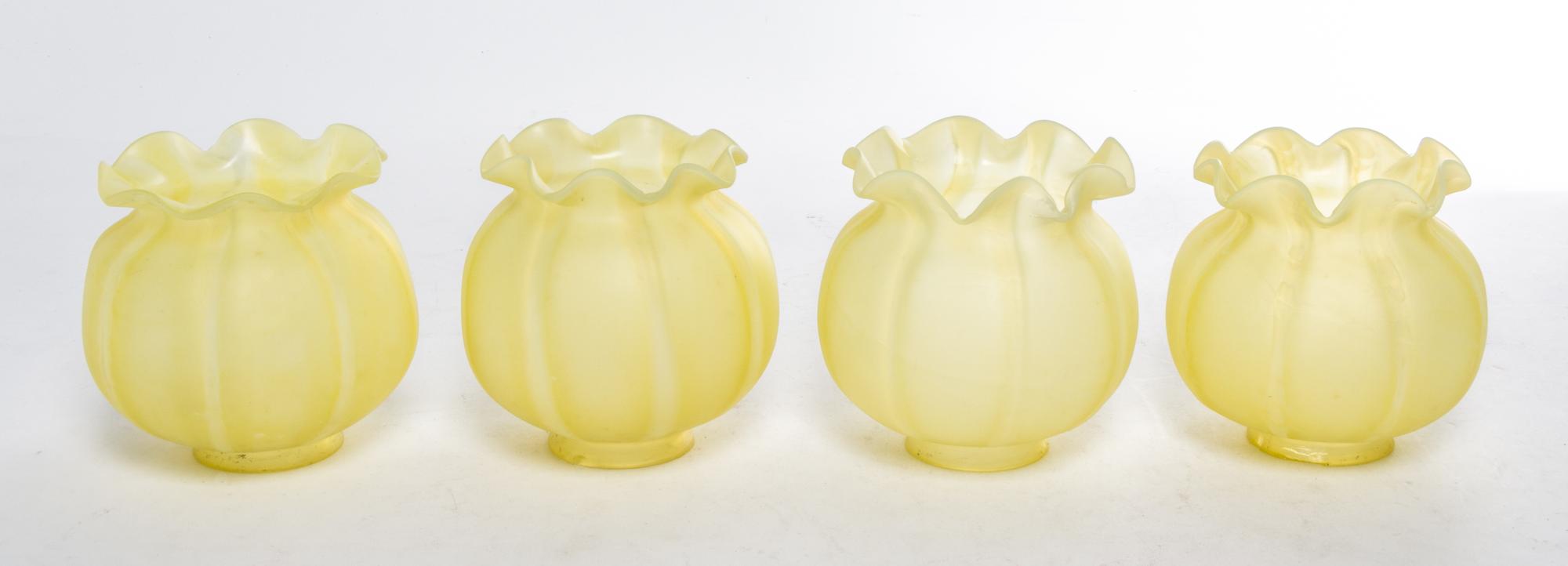 A Set of Four Yellow Glass Shades Height 5 inches.