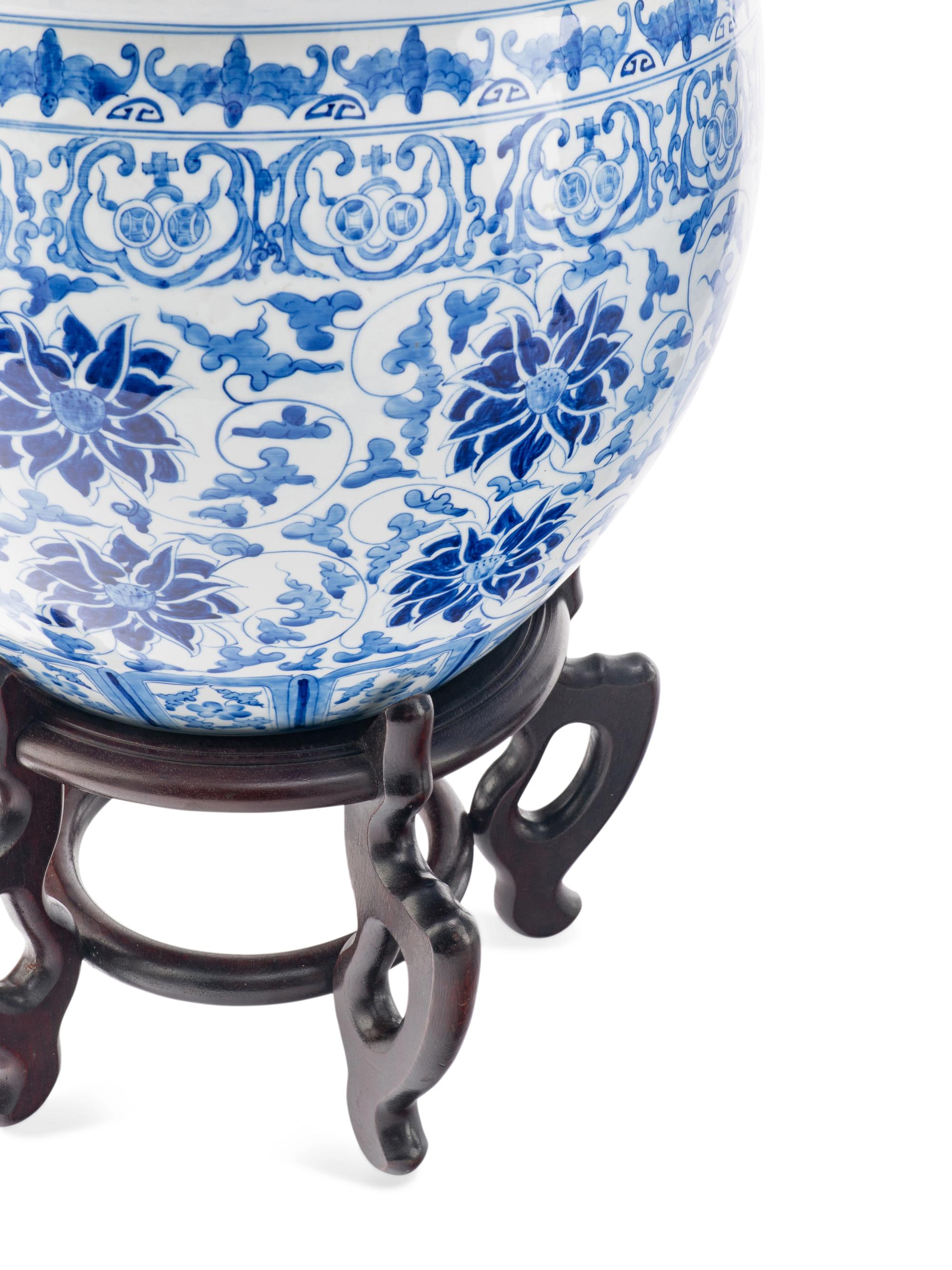 A Pair of Blue and White Porcelain Jardinieres with Wood Stands