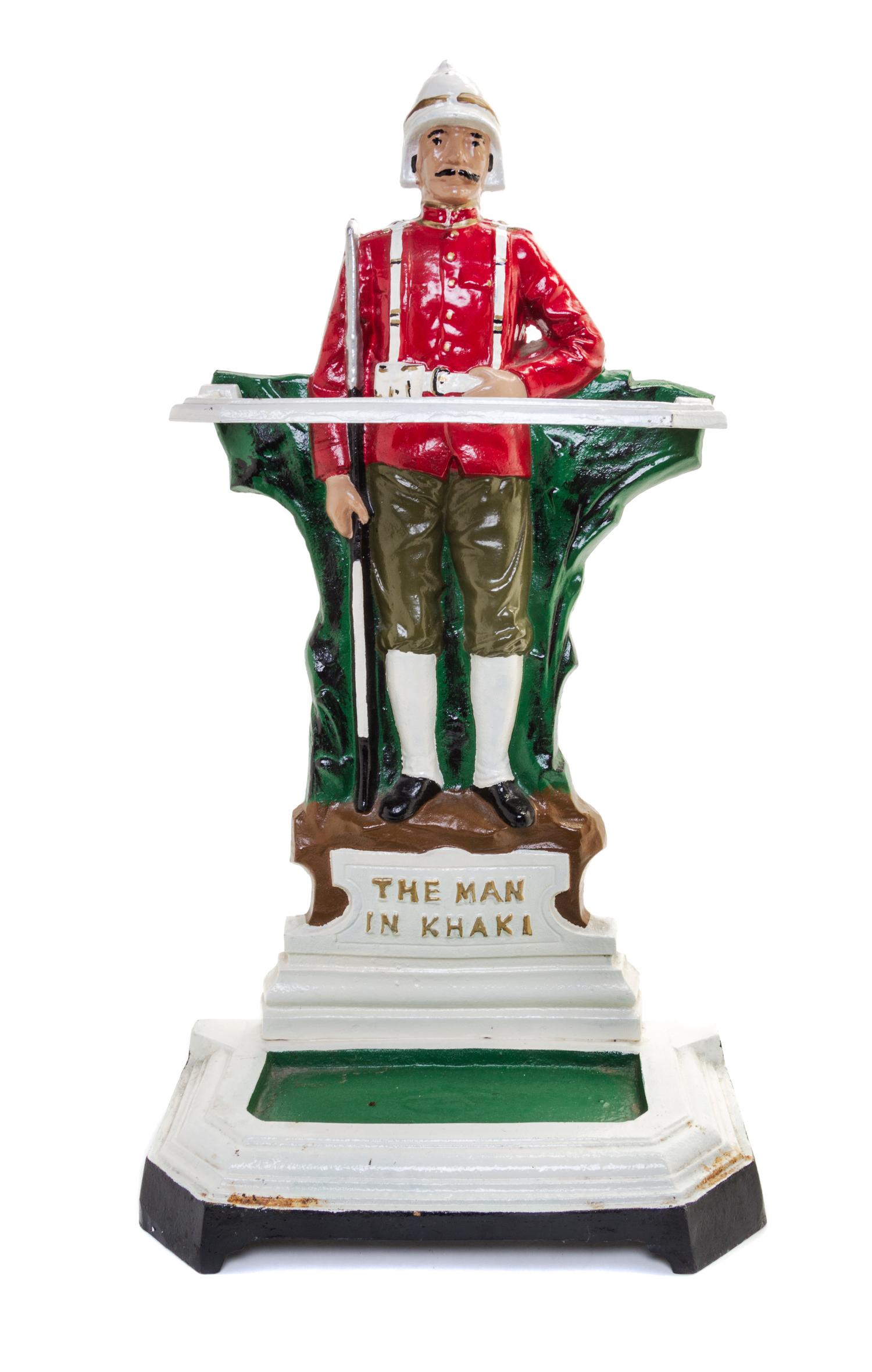 A Victorian Painted Iron Figural Umbrella Stand Height overall 28 inches.