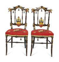 A Set of Four Black and Polychrome Chinoiserie-Decorated Chairs