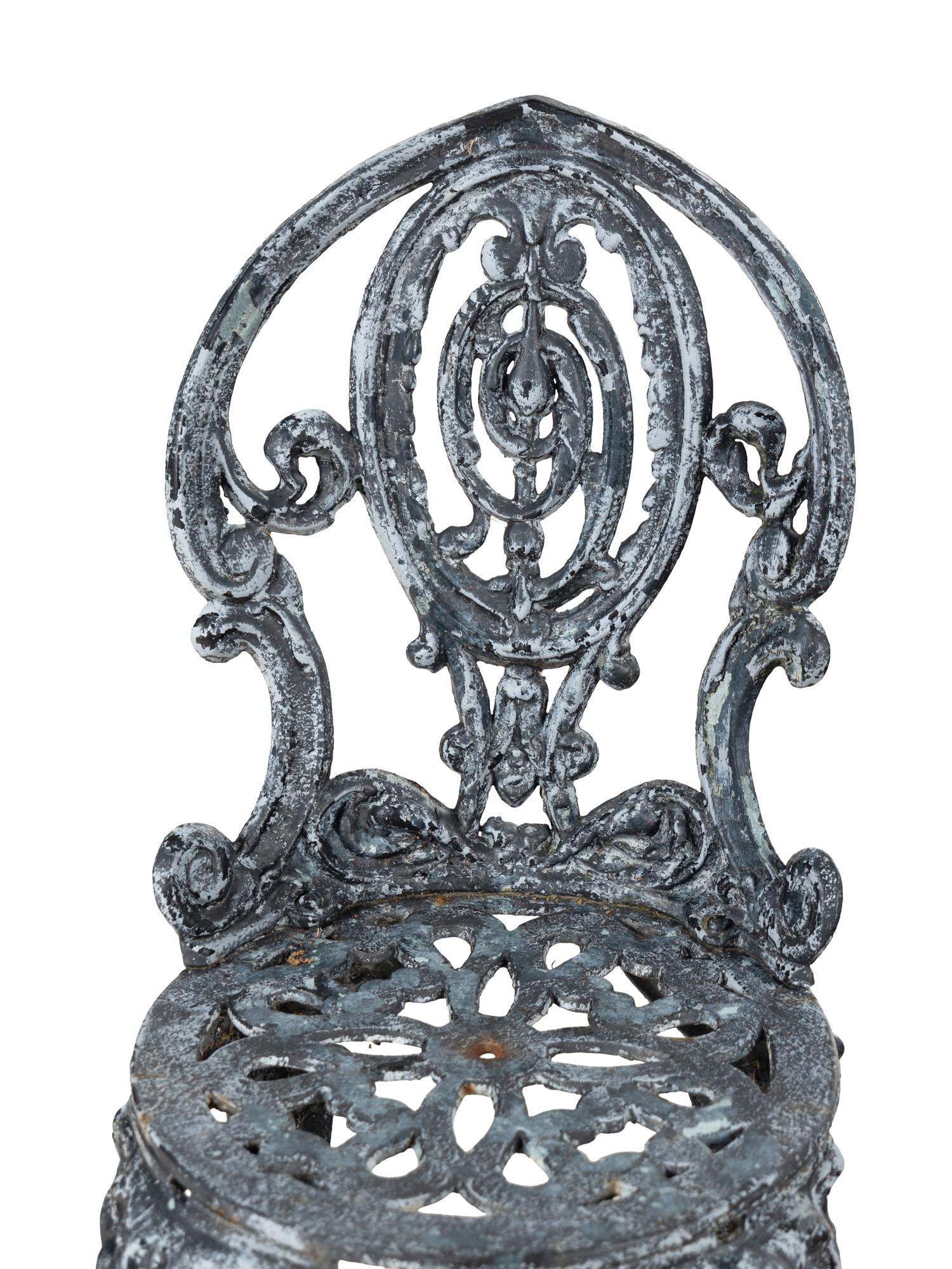 A Set of Four Wrought Iron Chairs