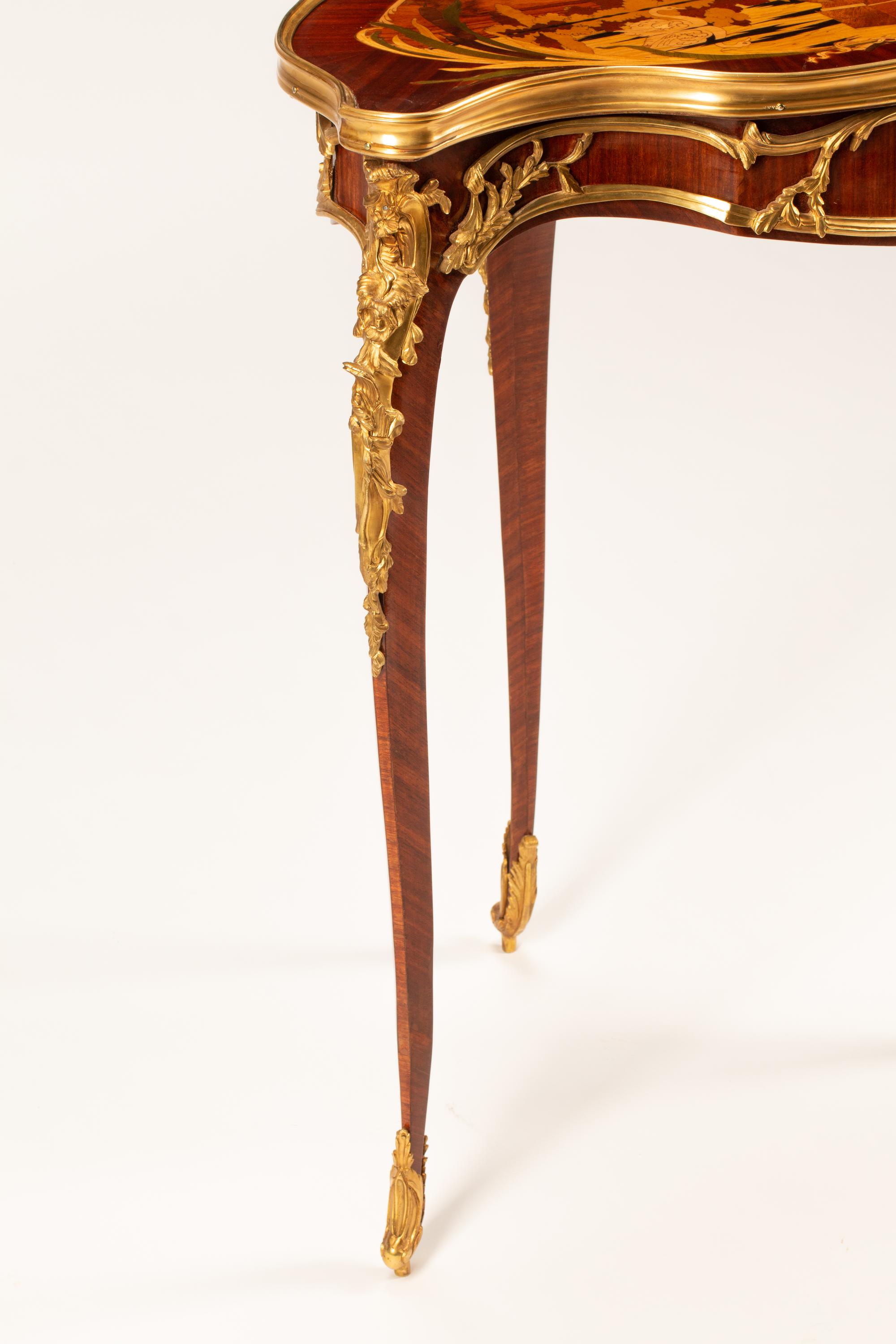 A Louis XV Style Marquetry Cartouche Table