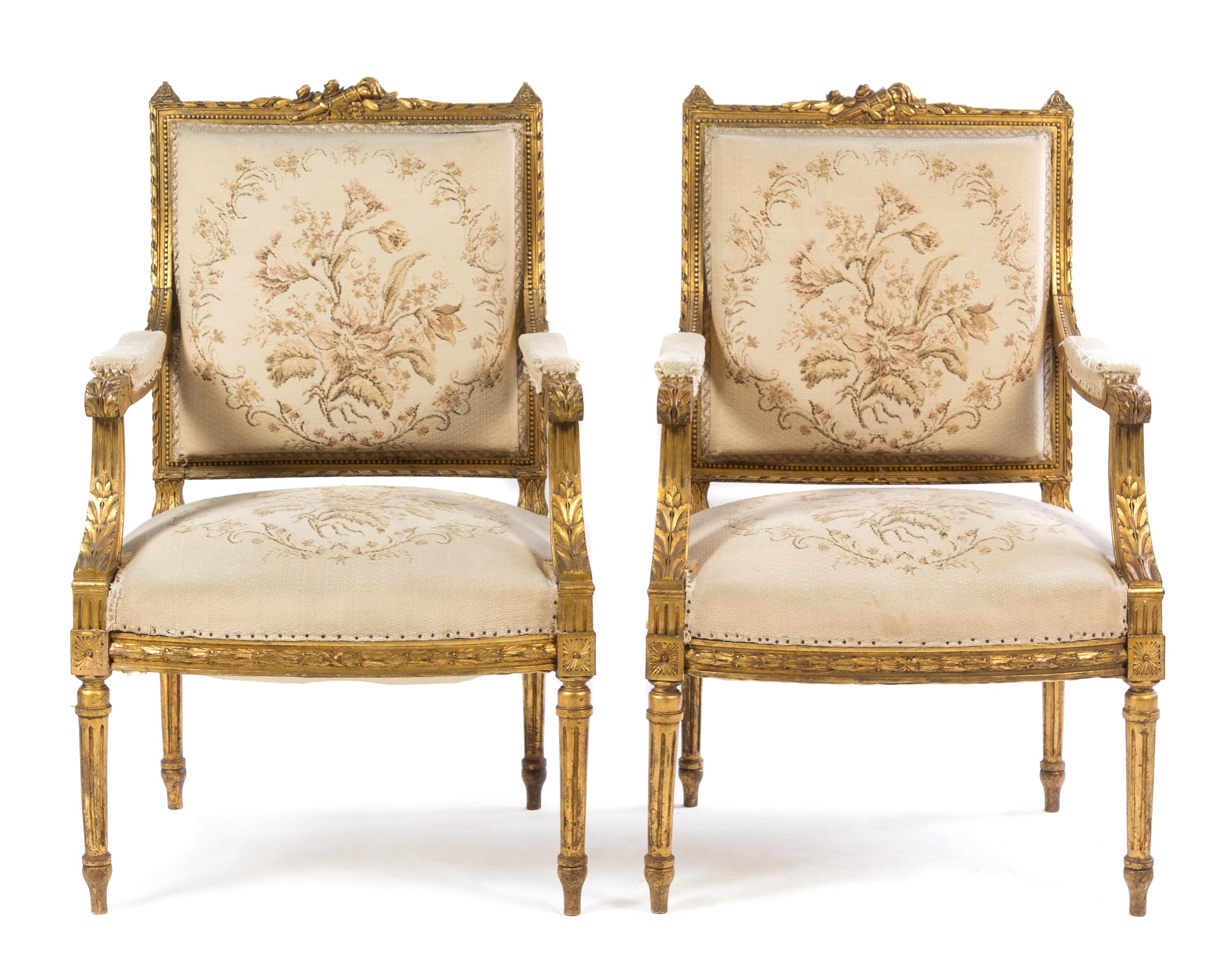 A Pair of Louis XVI Style Giltwood Fauteuils Height 38 x width 24 1/2 x depth 19 inches. — 19TH CENTURY