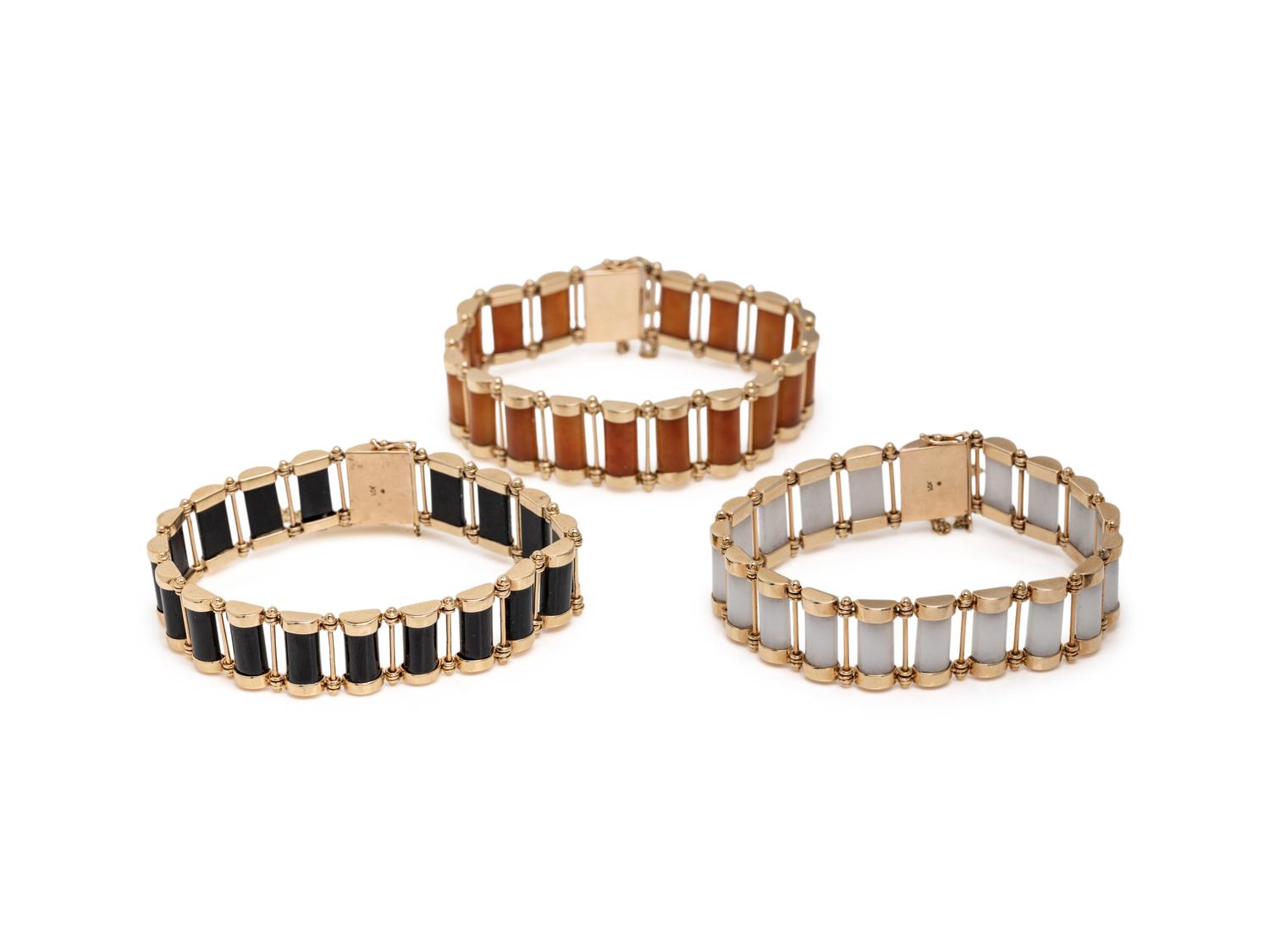 COLLECTION OF YELLOW GOLD AND JADE BRACELETS