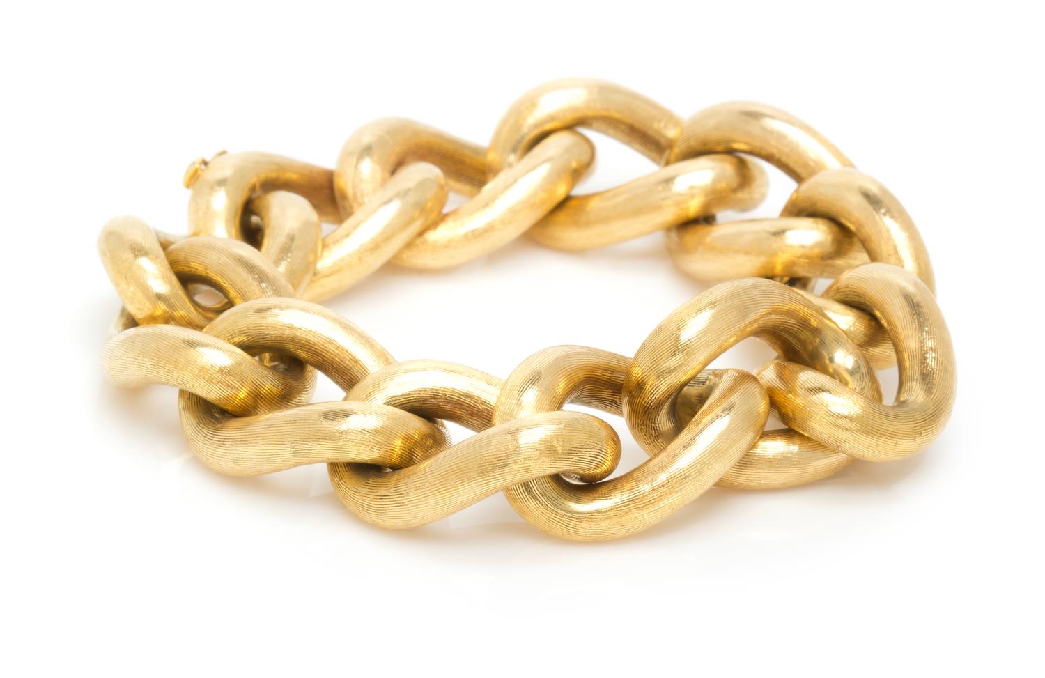 An 18 Karat Yellow Gold Textured Curb Link Bracelet, 44.70 dwts.