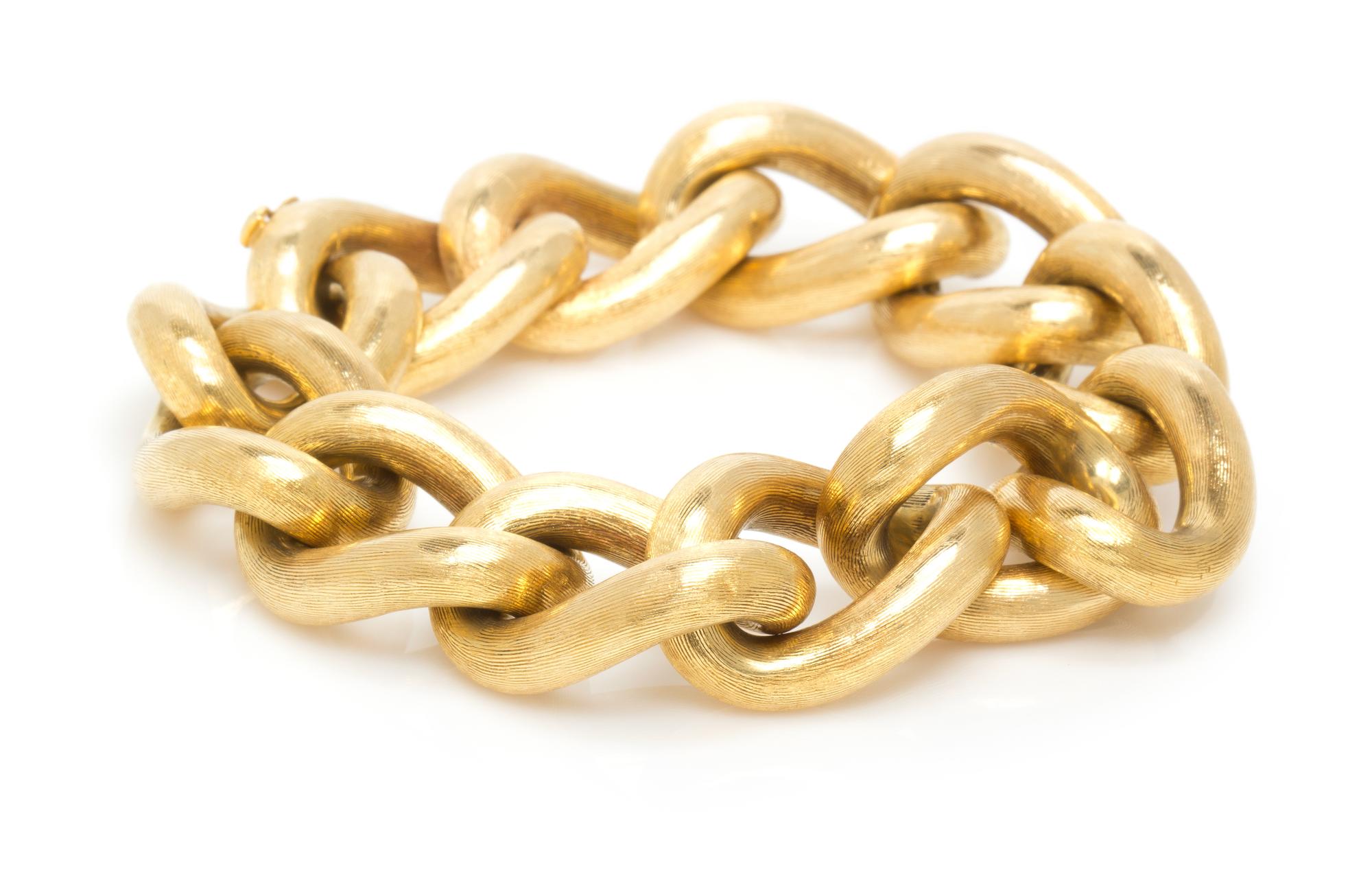 An 18 Karat Yellow Gold Textured Curb Link Bracelet, 44.70 dwts.