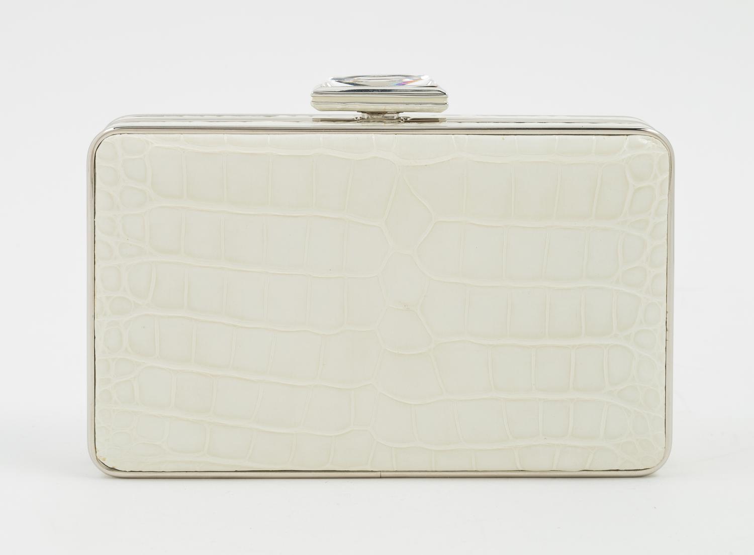 A Judith Leiber Cream Crocodile Clutch, 6" x 3.5" x 1.5".